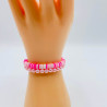 Pulseras de colores rosa y blanco