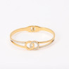 Brazalete de acero inoxidable chapado en oro con anillas